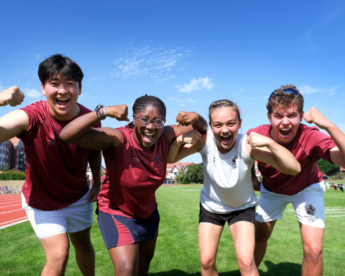 Group of students flexing