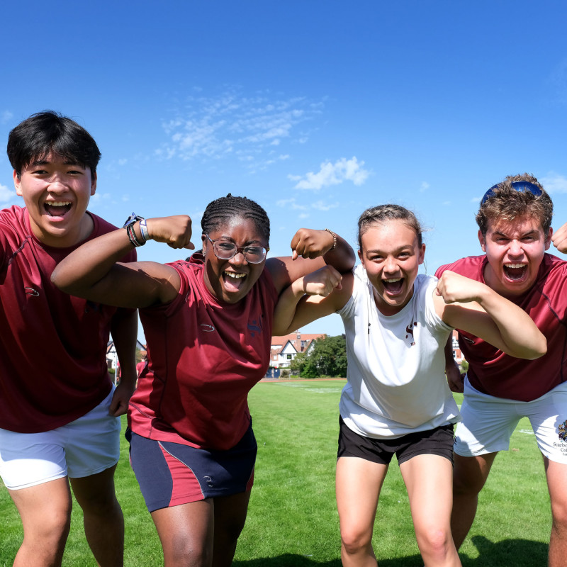 Group of students flexing