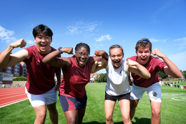 Group of students flexing